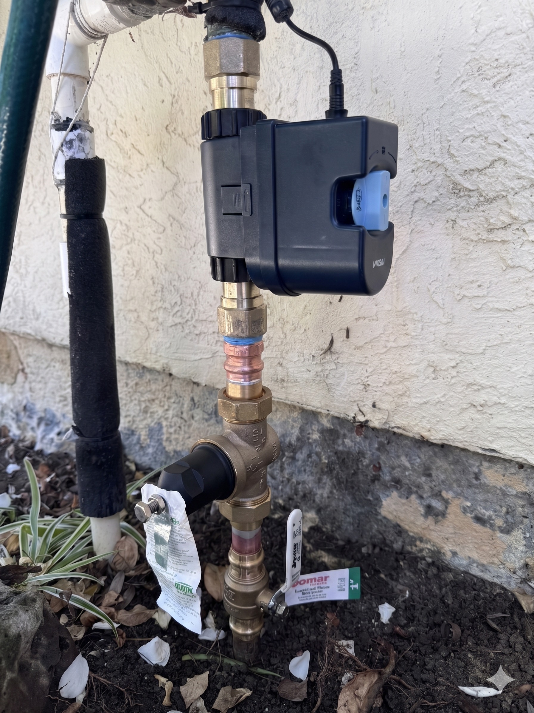 Smart Wi-Fi water leak detector and shutoff valve installed on the main water line