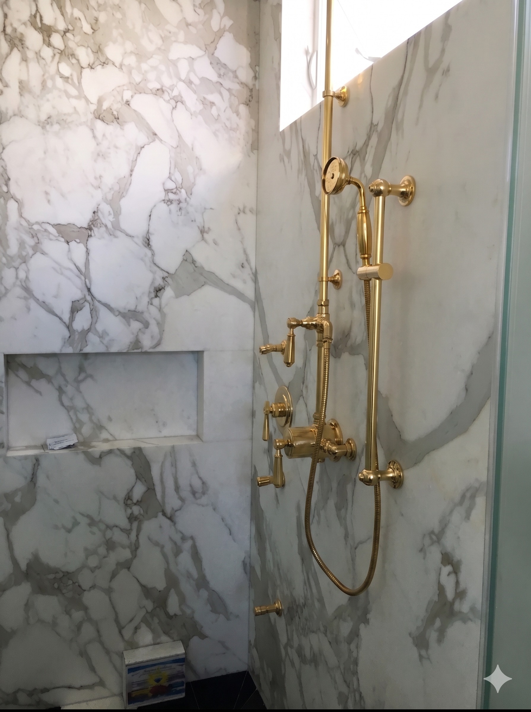 High-end marble shower with brass thermostatic valve, hand shower, and built-in niche